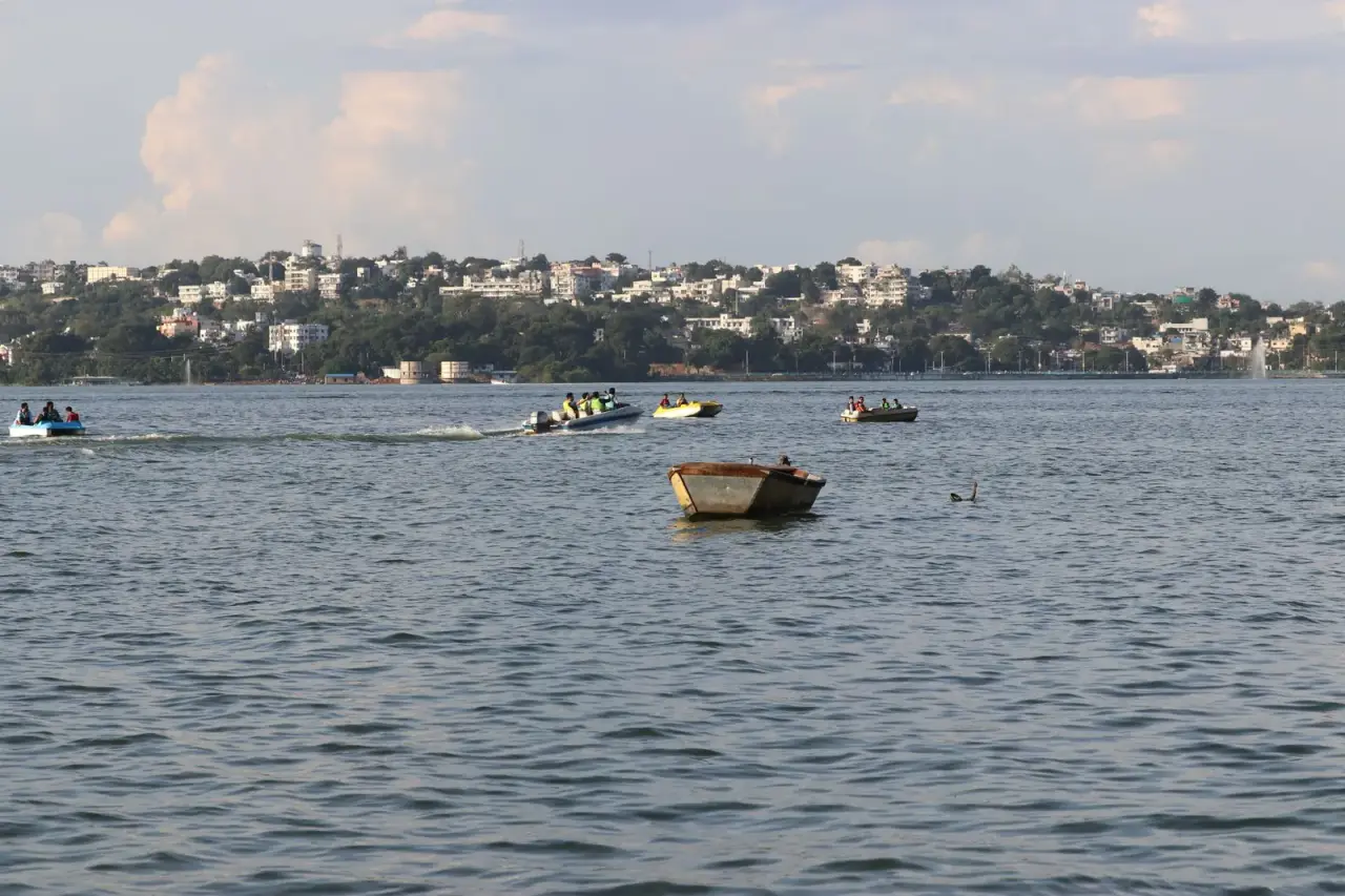 Boats on the Upper Lake in Bhopal with the city behind